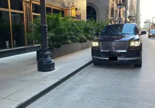Black Lincoln Navigator Standing on a side of road